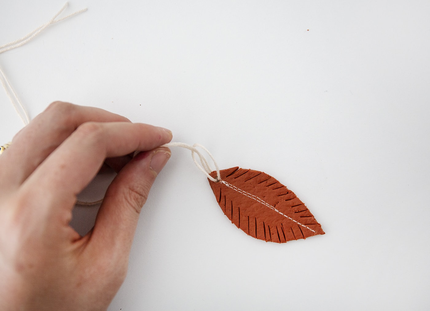 DIY Fimo Feather Wall Hanging